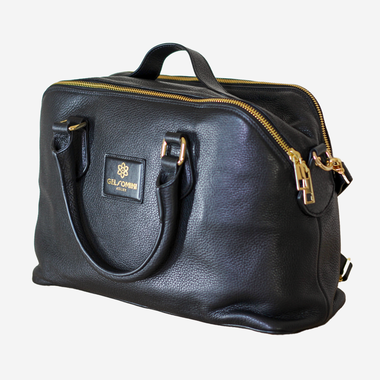 ROME - Handcrafted leather bag with double compartment and removable shoulder strap.